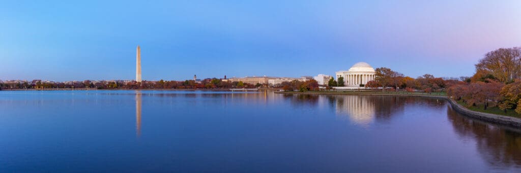 Jefferson Memorial and Washington Monument reflected on Tidal Basin in the evening.